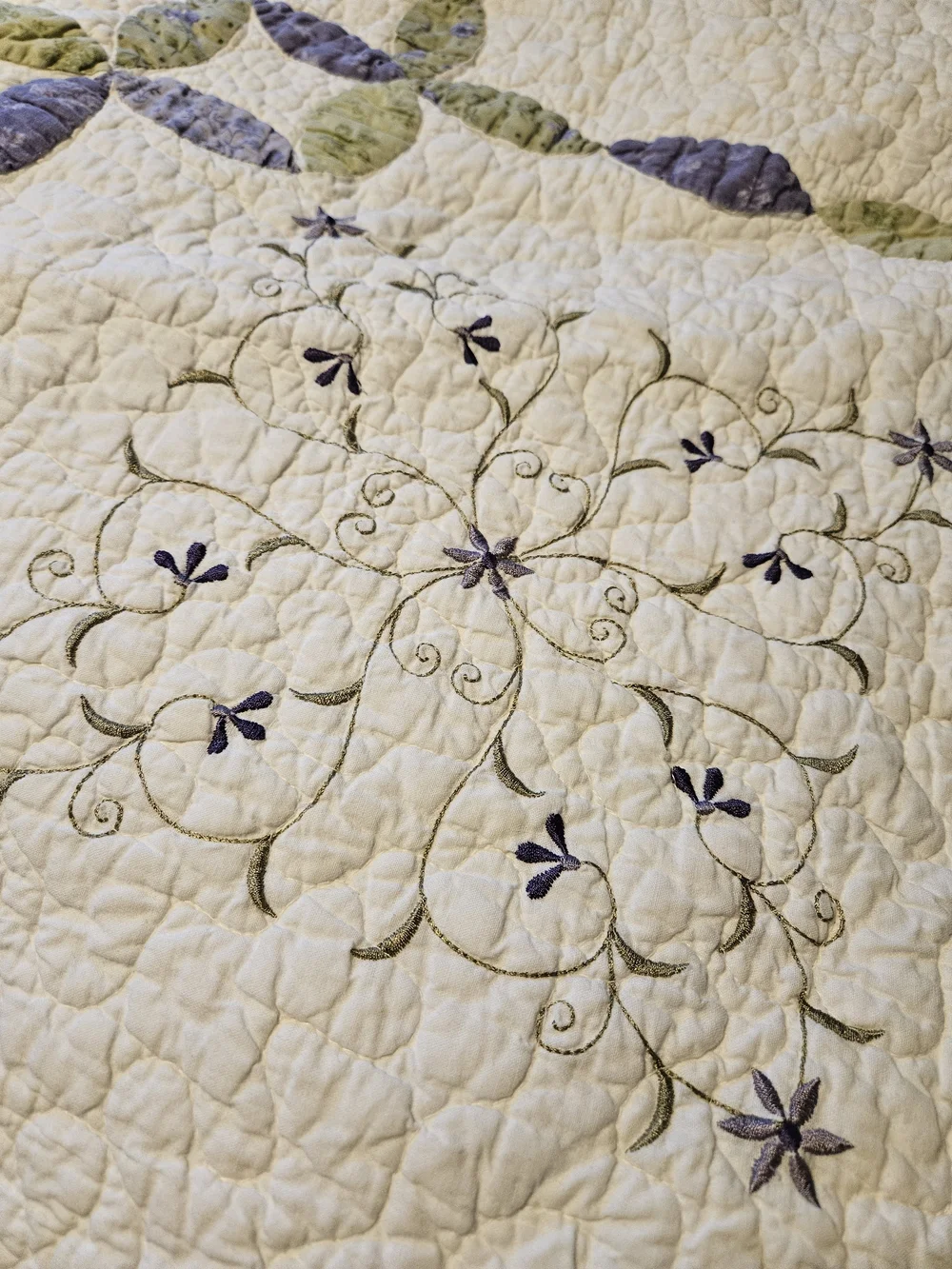 White Quilted Bedspread with Lavender and Sage Ring Pattern